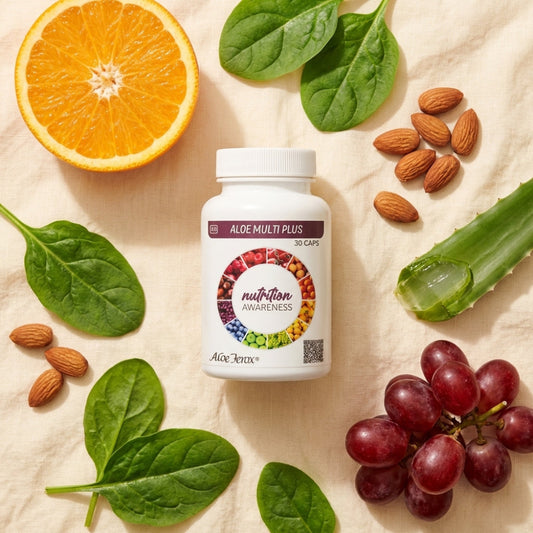 Aloe Multi Plus supplement bottle surrounded by fruits, vegetables, and nuts on a beige background