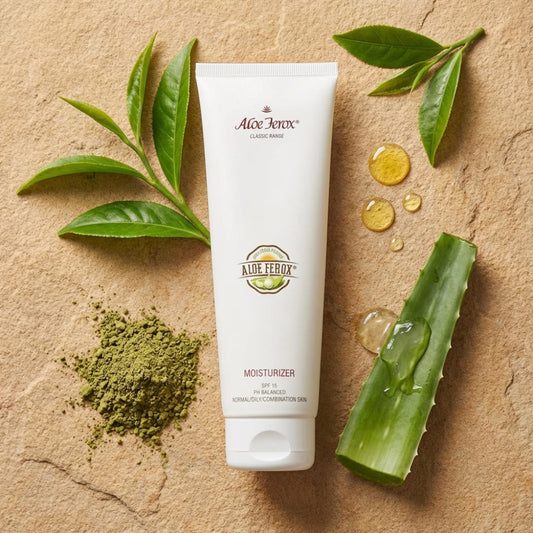 Aloe Ferox Moisturizer on a stone surface surrounded by aloe leaves