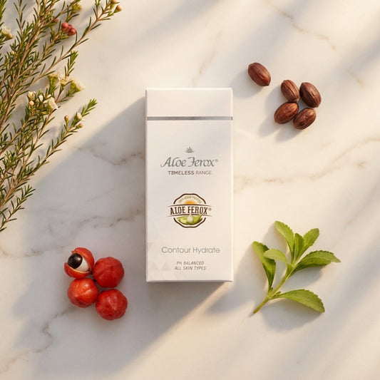 Aloe Ferox contour hydrate skincare product packaging on a marble surface with natural elements.