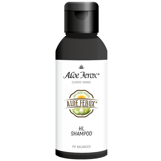A bottle of Aloe Ferox HL shampoo on a white background