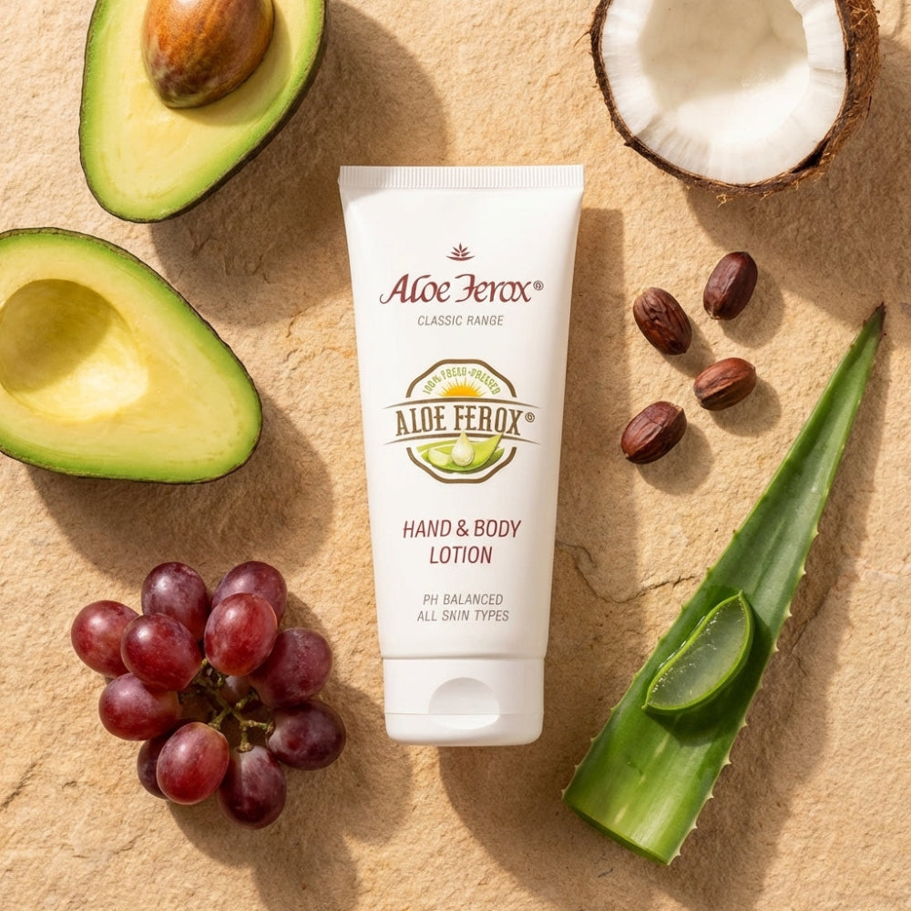 Aloe Ferox hand and body lotion with avocados, grapes, and aloe vera on a beige background