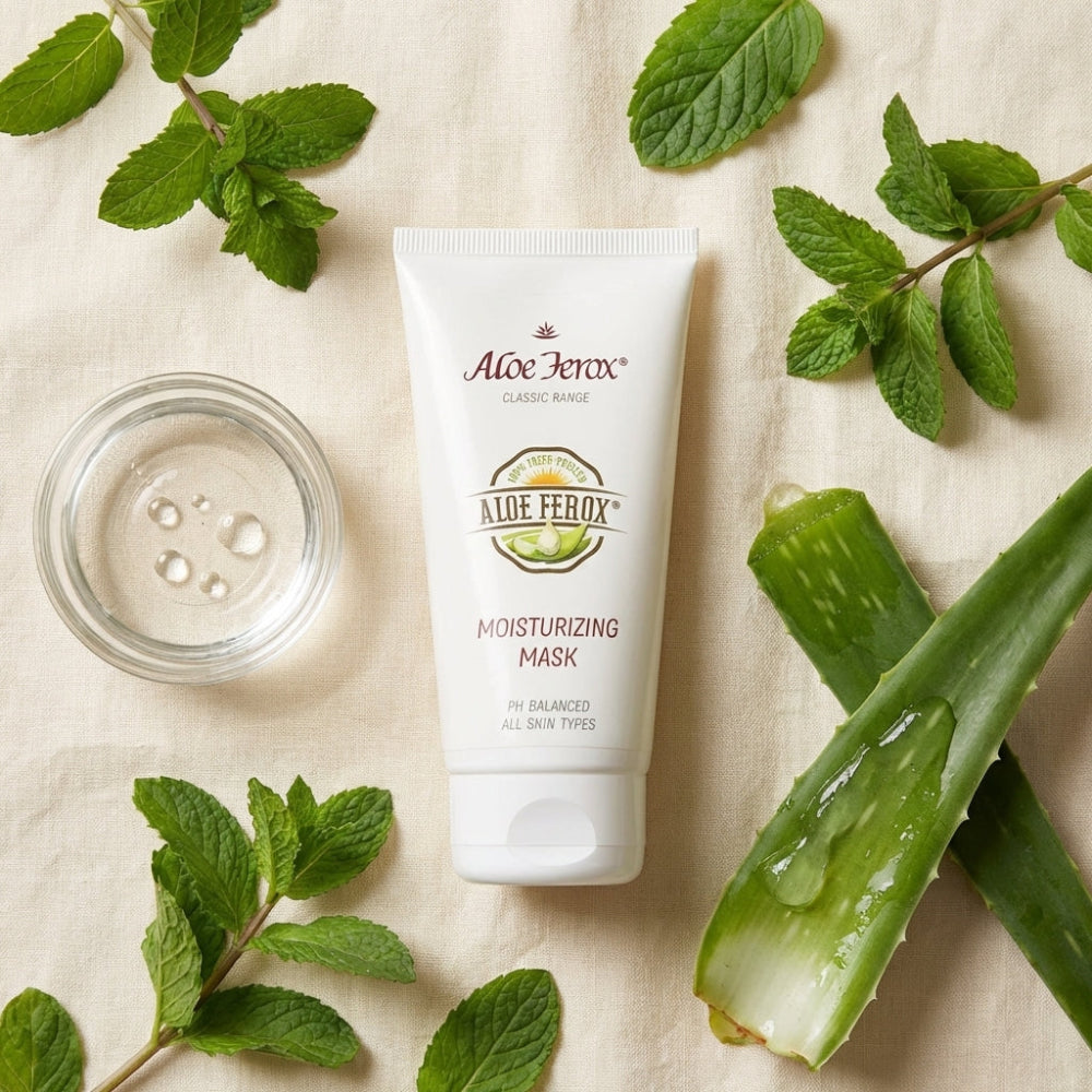 Aloe Ferox moisturizing mask tube with aloe ferox leaves and mint leaves on a beige background