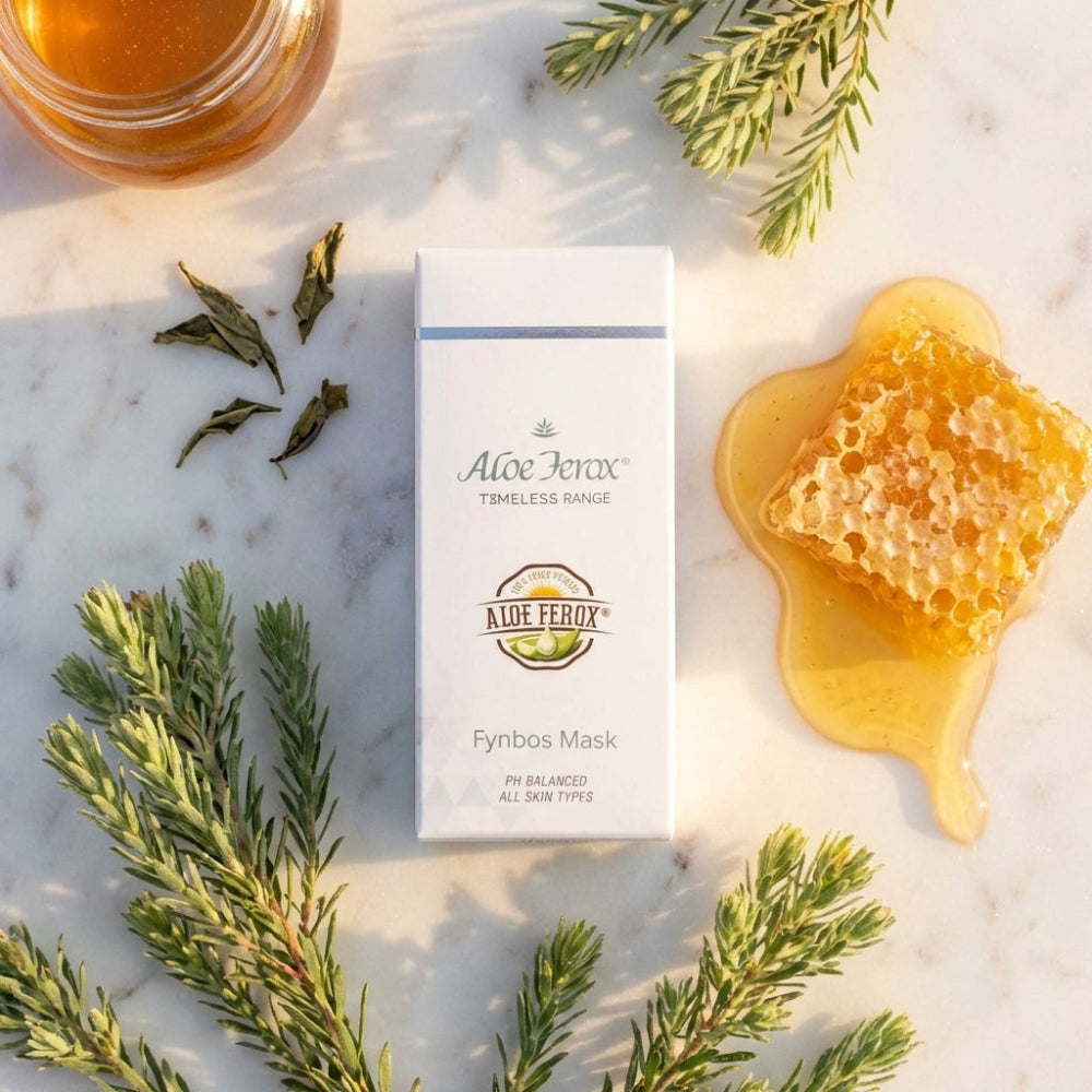 Aloe Ferox mask packaging with honey and herbs on a marble surface