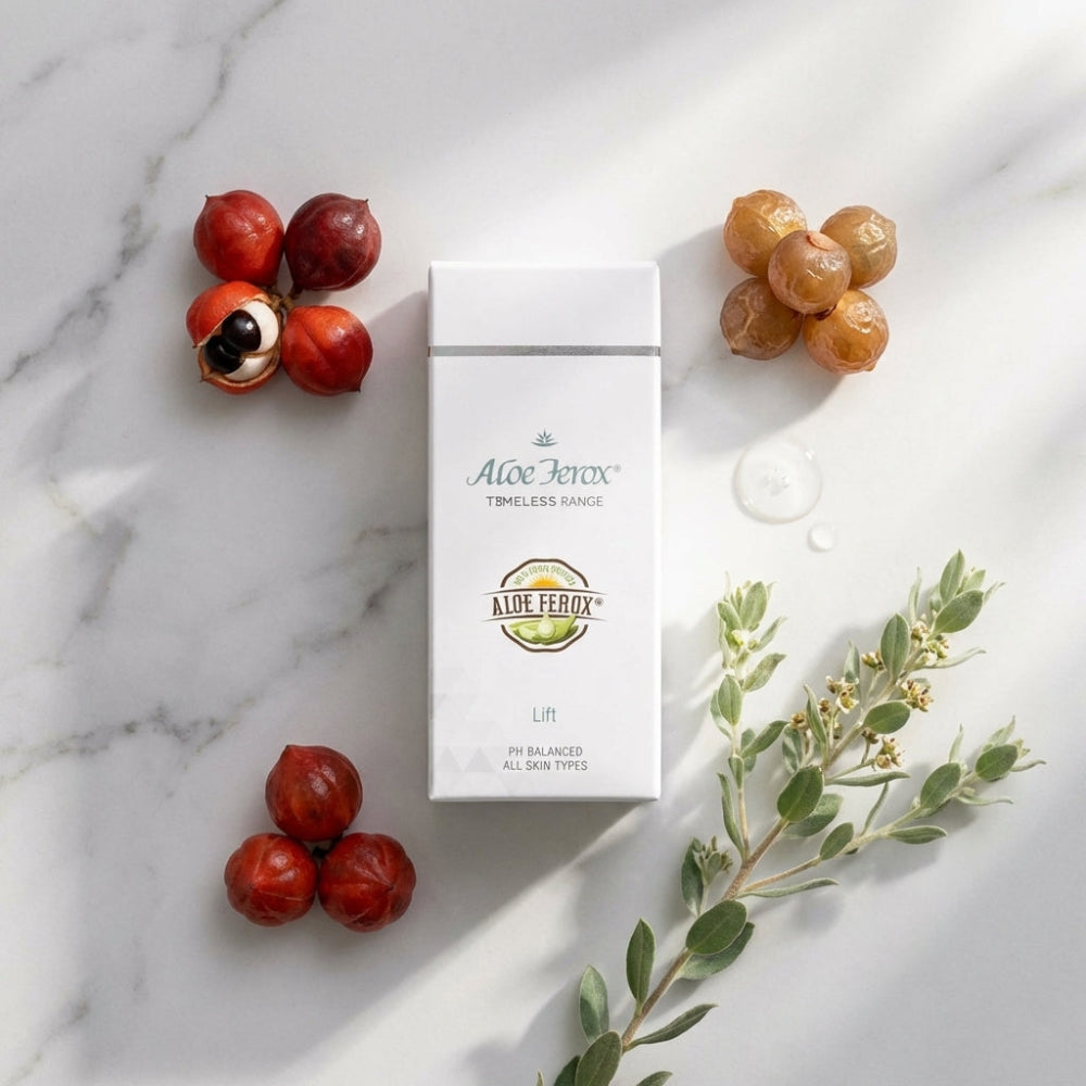 Aloe Ferox lift skincare product packaging on a marble surface with fruits and leaves.