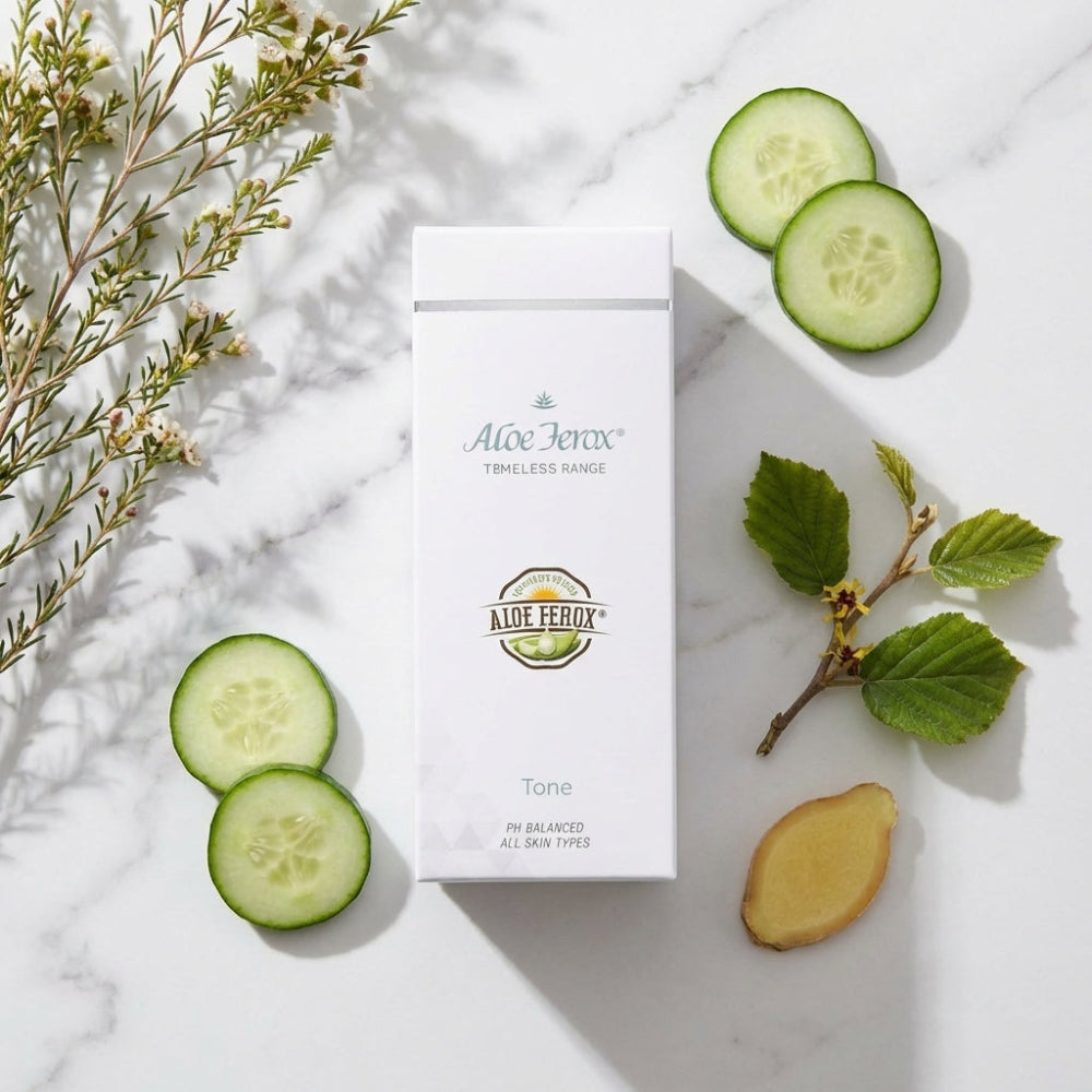 Aloe Ferox Timeless Toner on a marble surface with cucumber slices